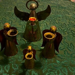 4 Vintage brass angels 
The tallest is 8.25”, 2 are 6” tall and the small is 4”
